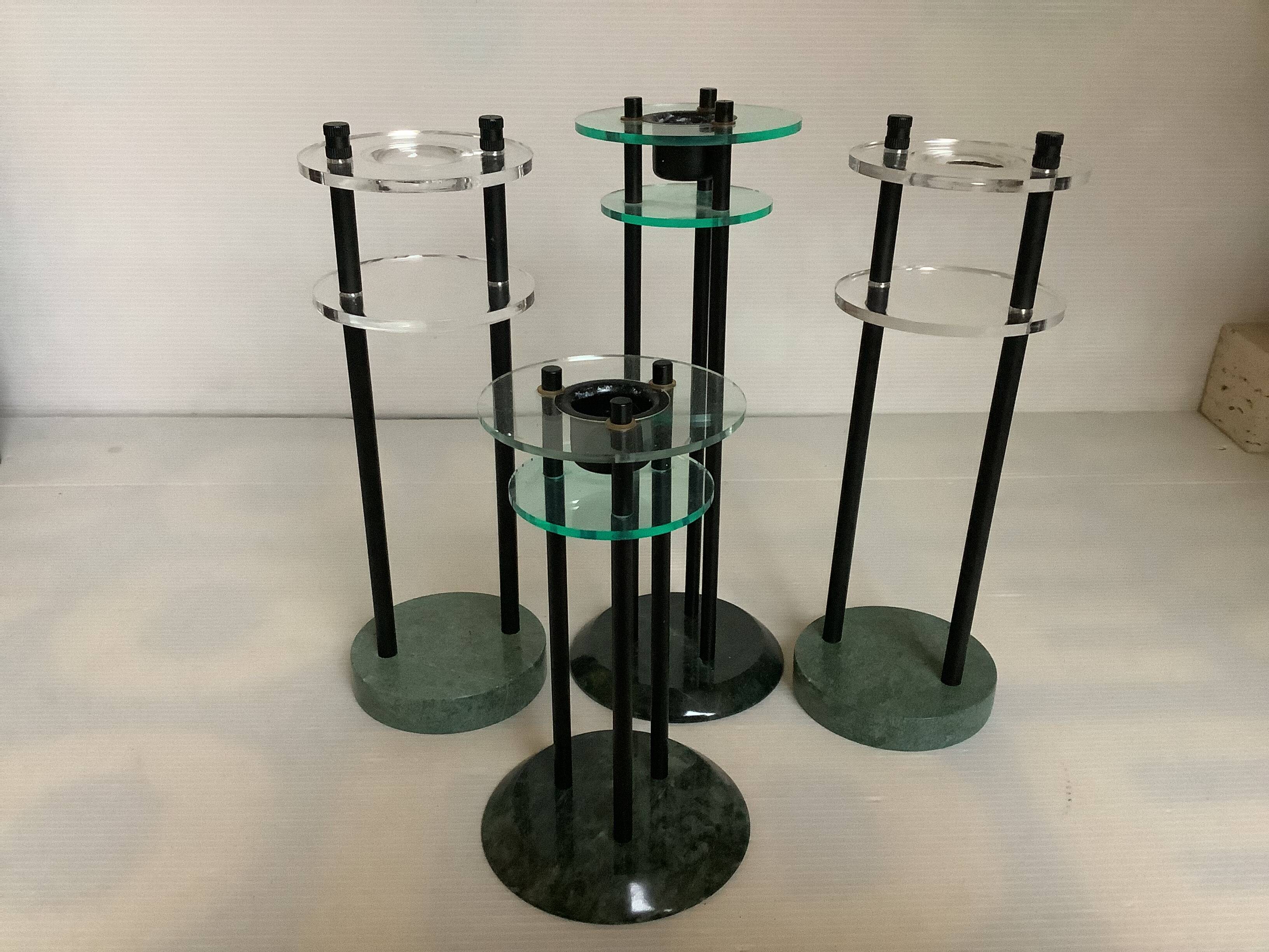 Four postmodernist green marble candlesticks