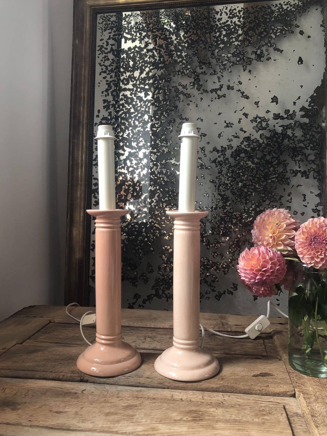 Pair of vintage salmon pink candlestick shaped ceramic lamp bases