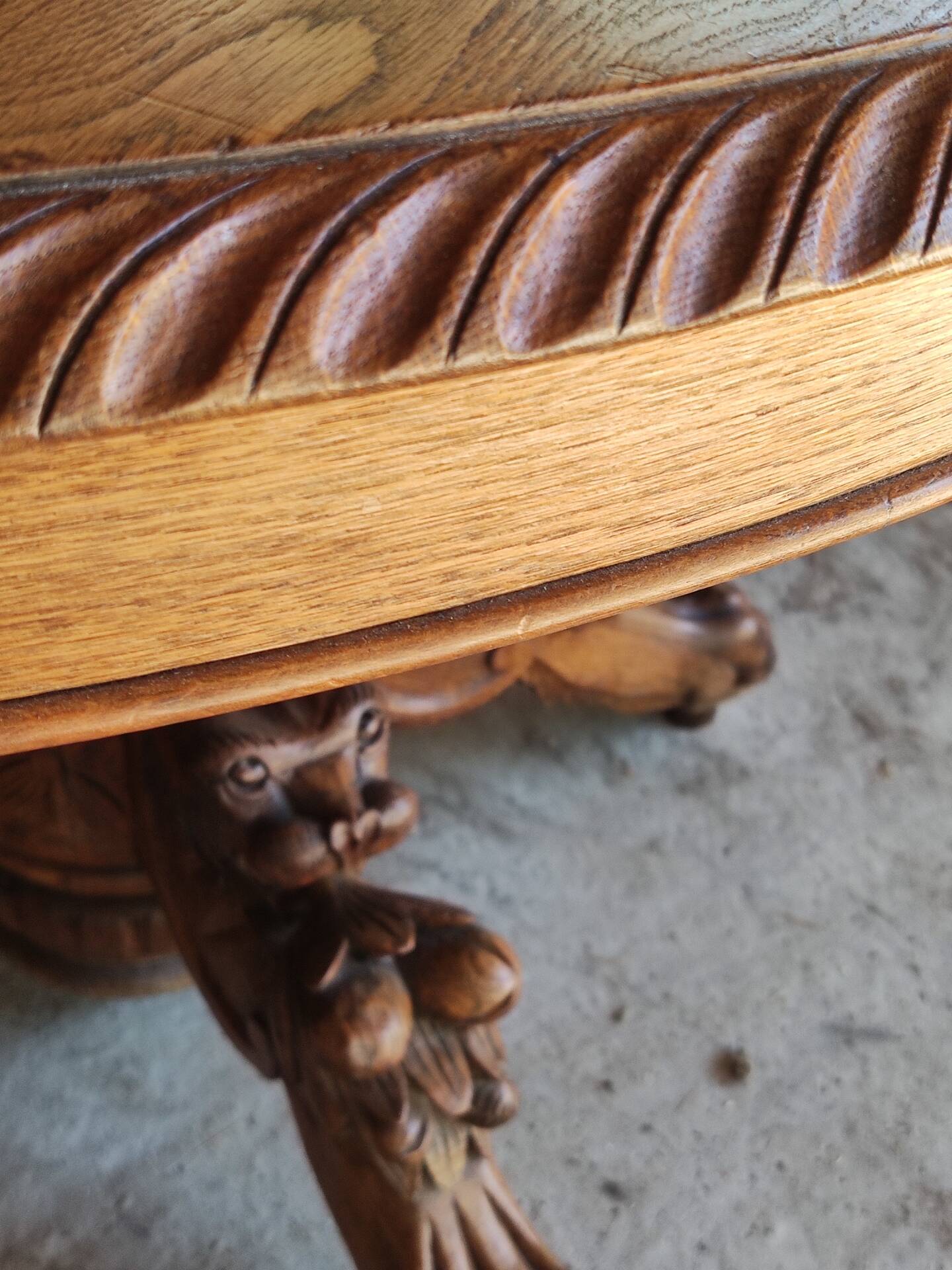 Oval oak table with carved details - known as a hunting table.