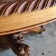 Oval oak table with carved details - known as a hunting table.