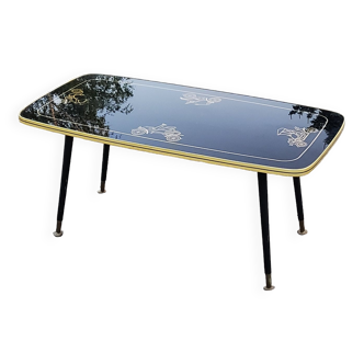 Coffee table from the 60s in black and gold glass, compass legs in blackened wood and brass