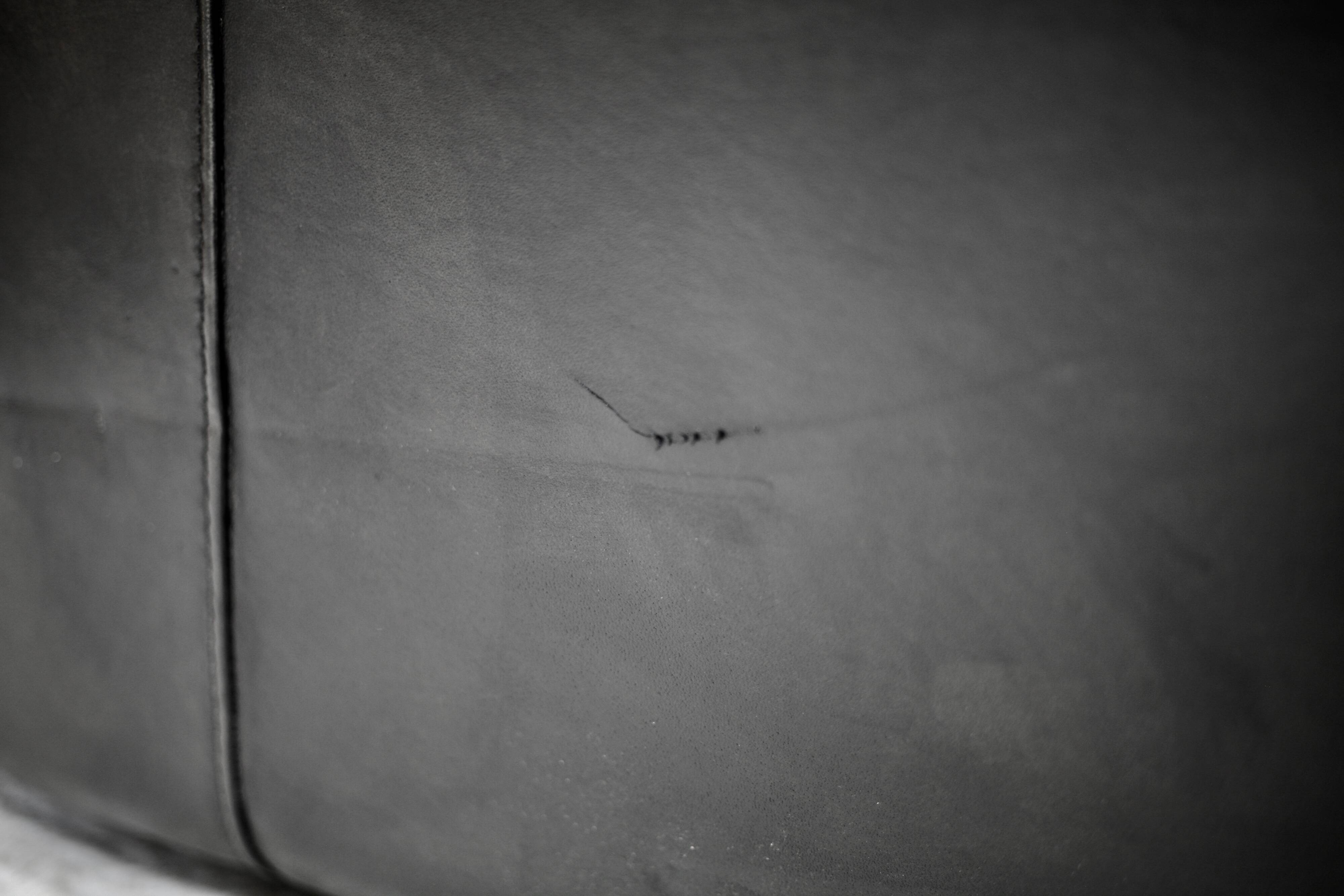 Large black leather armchair, France, 1980s