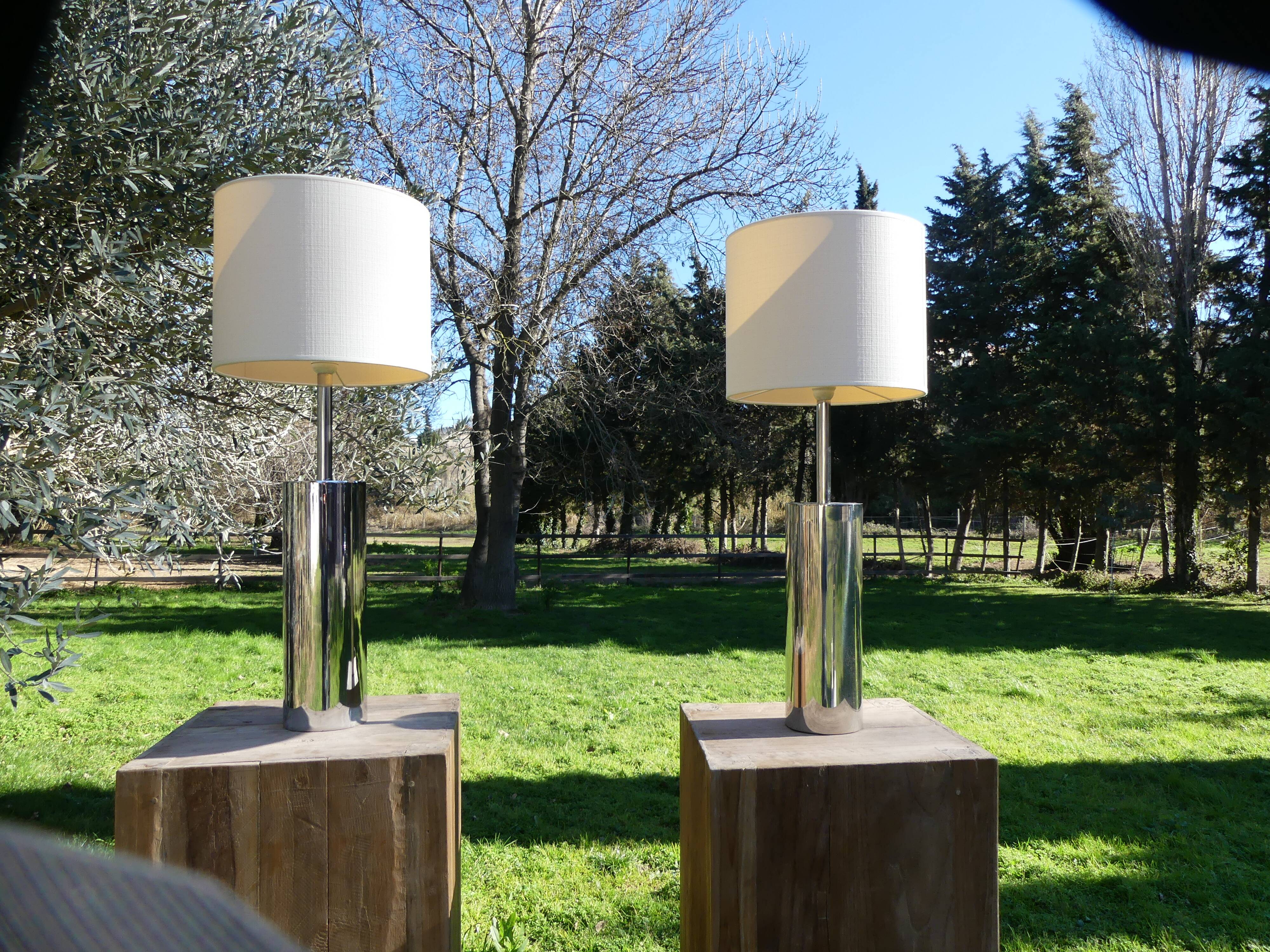 Foot of chrome lamps and ivory white lampshade
