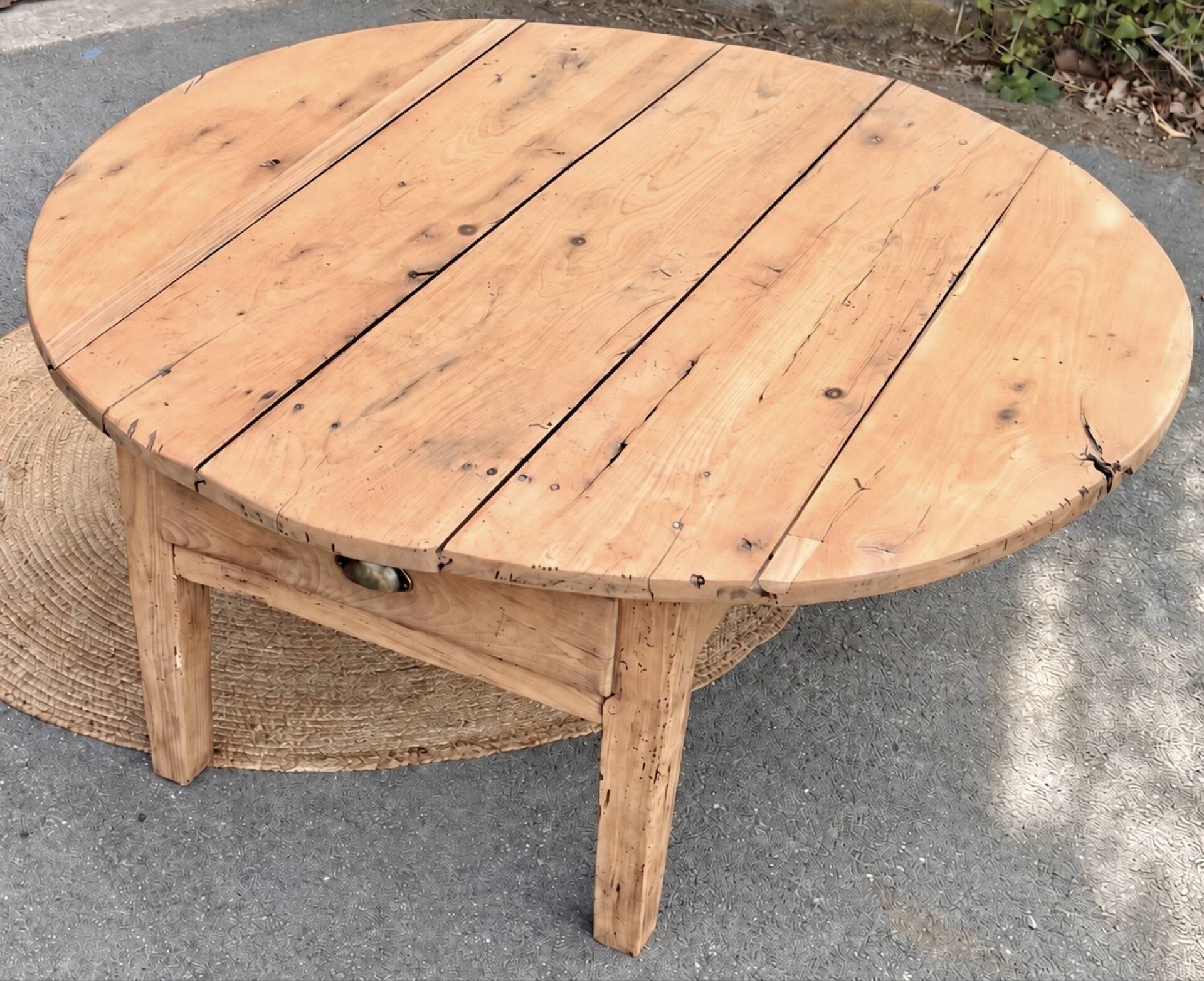 Round coffee table with 1 drawer, antique, made of raw solid wood.