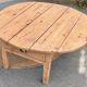 Round coffee table with 1 drawer, antique, made of raw solid wood.