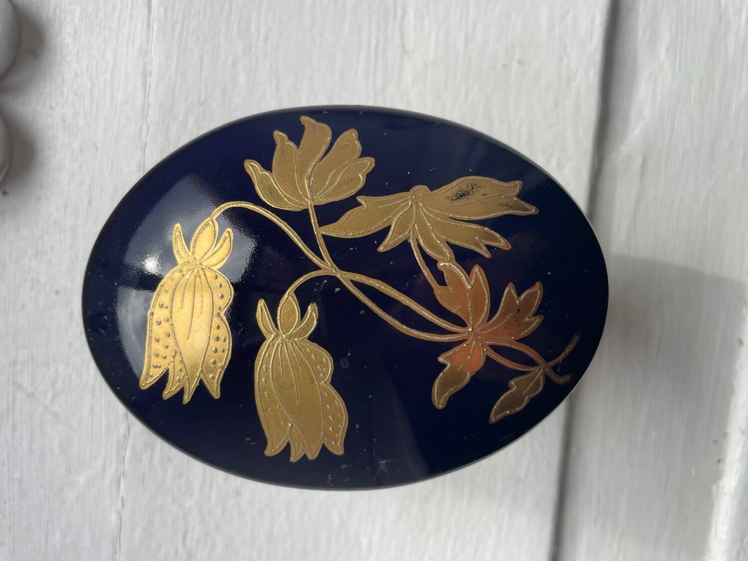 Cobalt blue and gold porcelain bonbonnière, signed JLMenau.