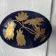 Cobalt blue and gold porcelain bonbonnière, signed JLMenau.