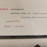 Olympia Alphamatic typewriter with Notice