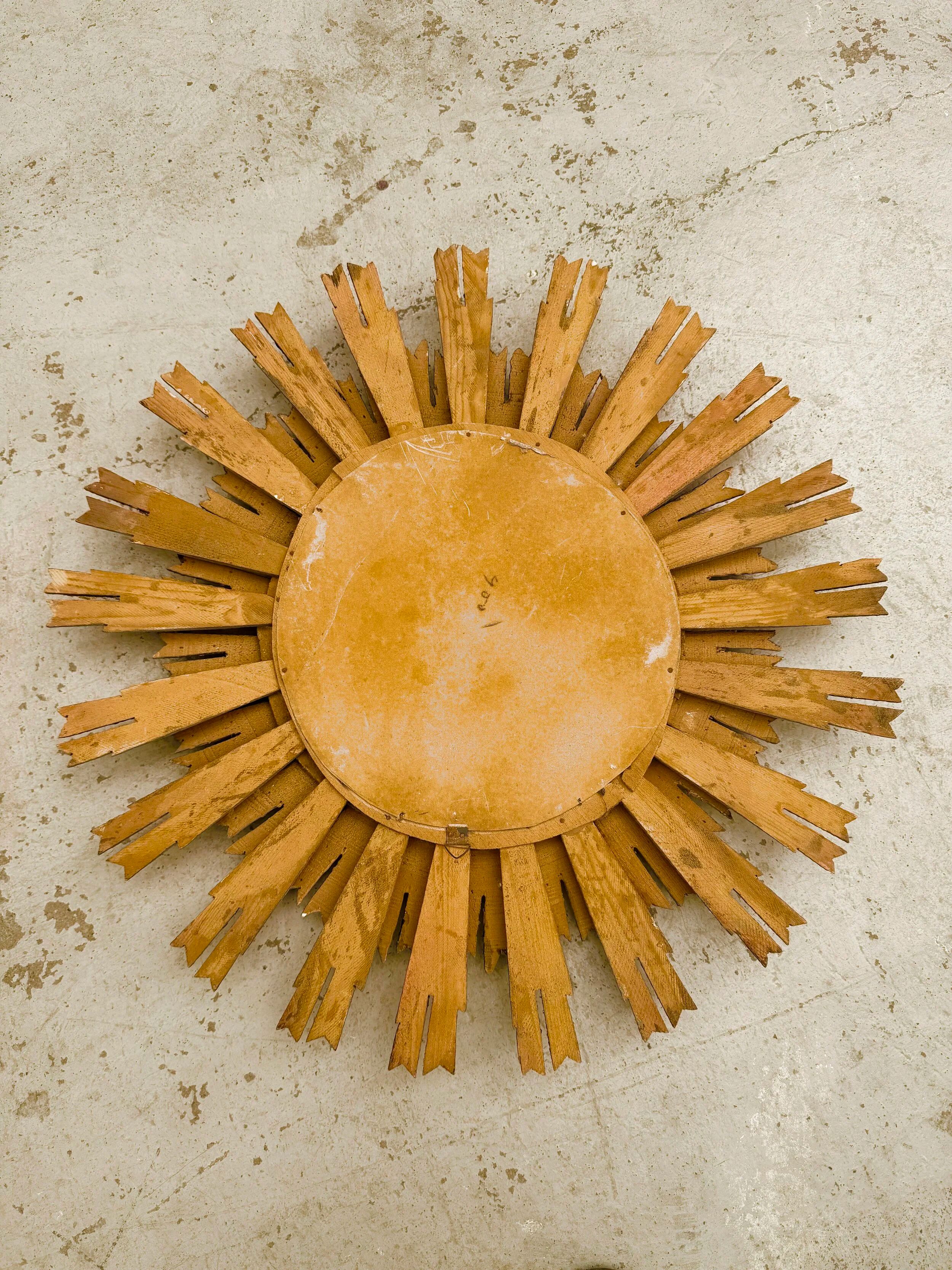 Large sun mirror in gilded wood, 1960