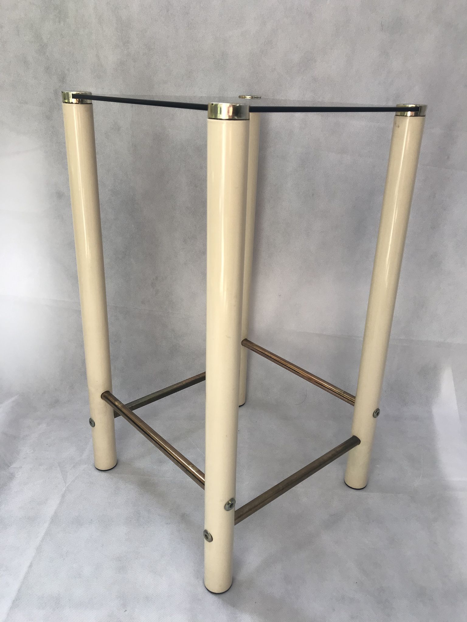 Square side table in metal and smoked glass.