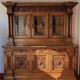 Two-body buffet, made of richly carved solid walnut.