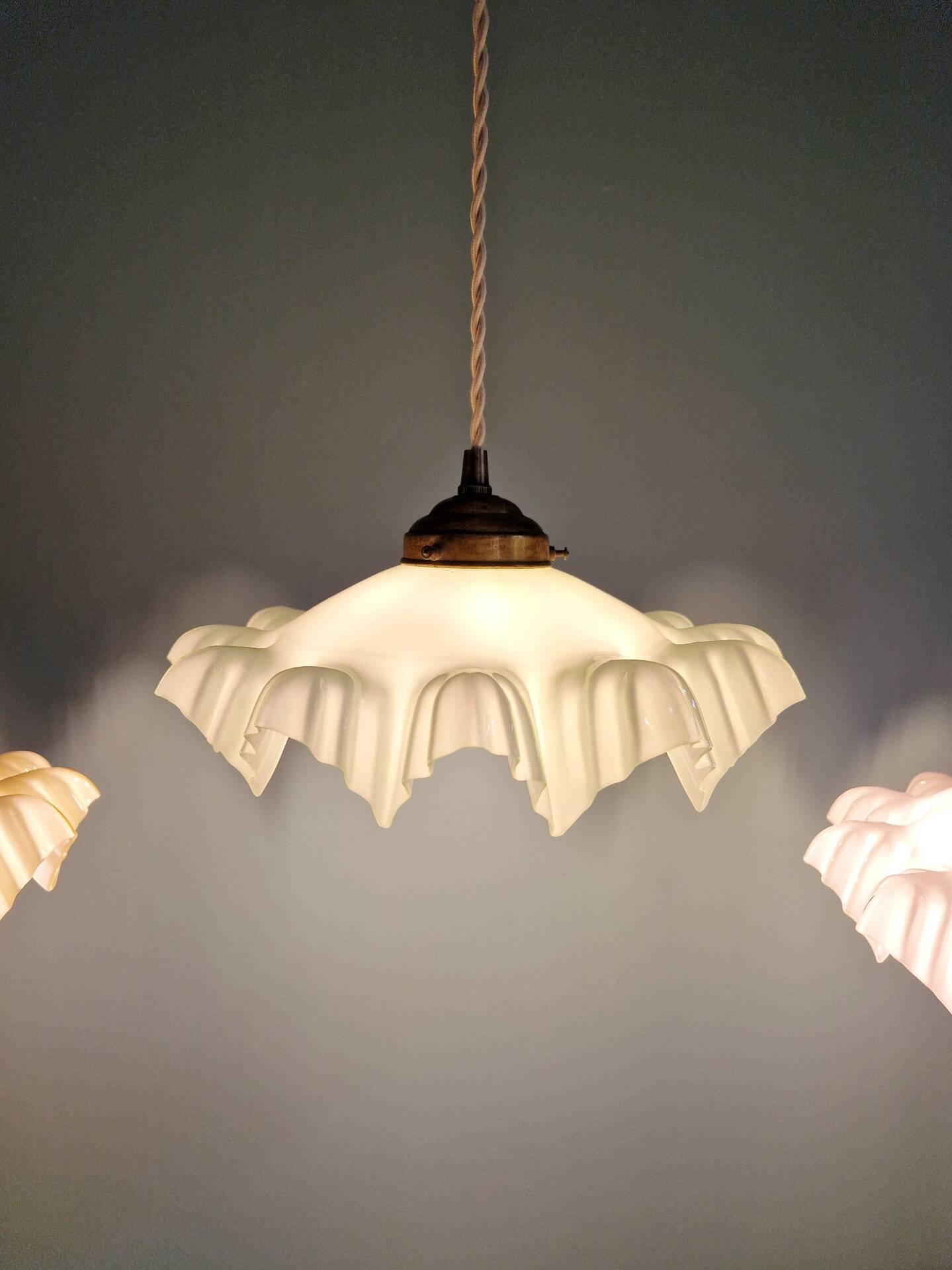 Art Deco trio of suspensions in coloured frilled opaline, 1920-30.