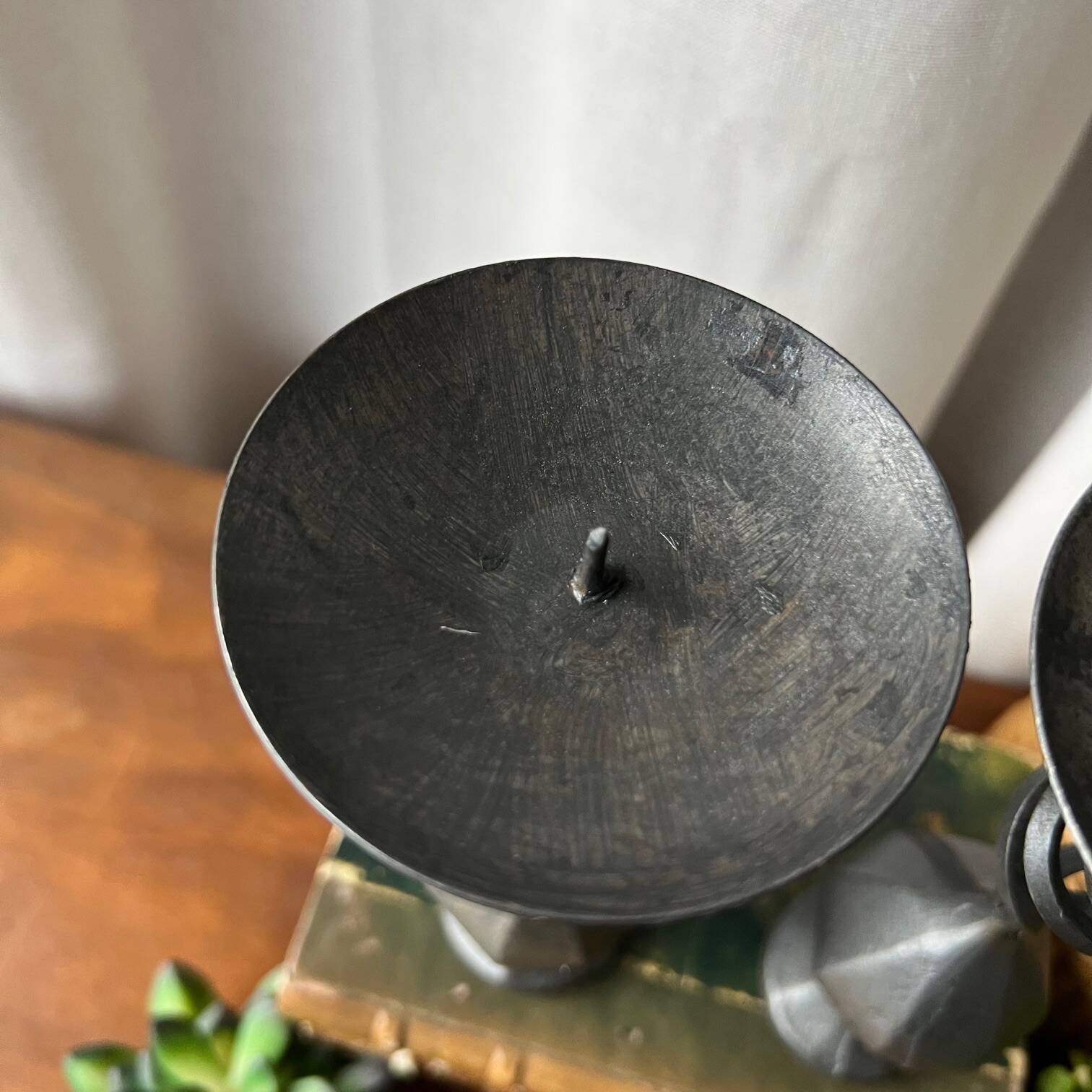 Pair of wrought iron candlesticks, black patina