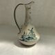Old pitcher in Dutch-made earthenware signed