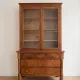 Antique wooden storage cabinet with display case.