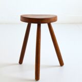 Old brutalist tripod stool in solid wood