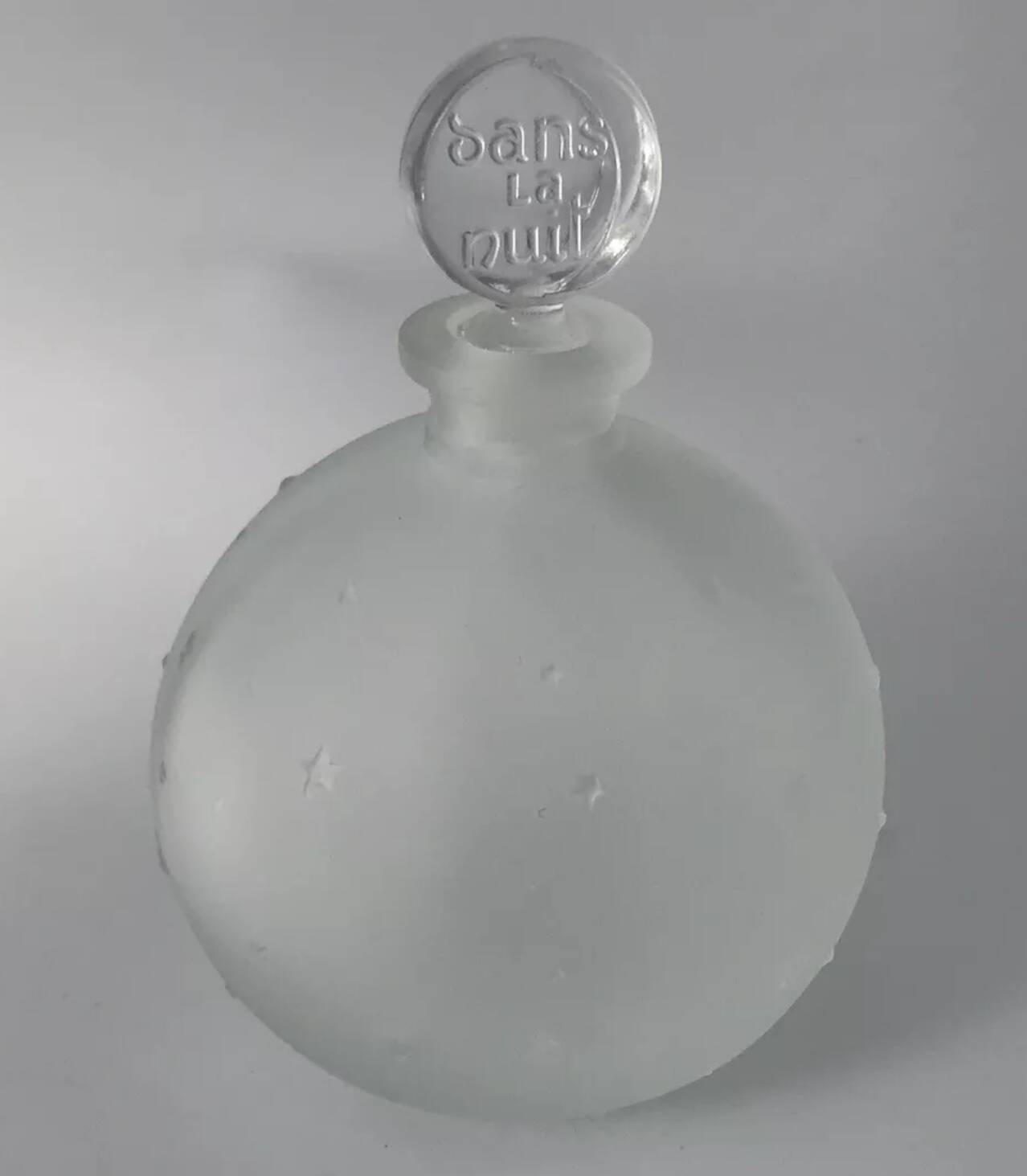 Lalique bottle in the night, frosted glass, ball shape