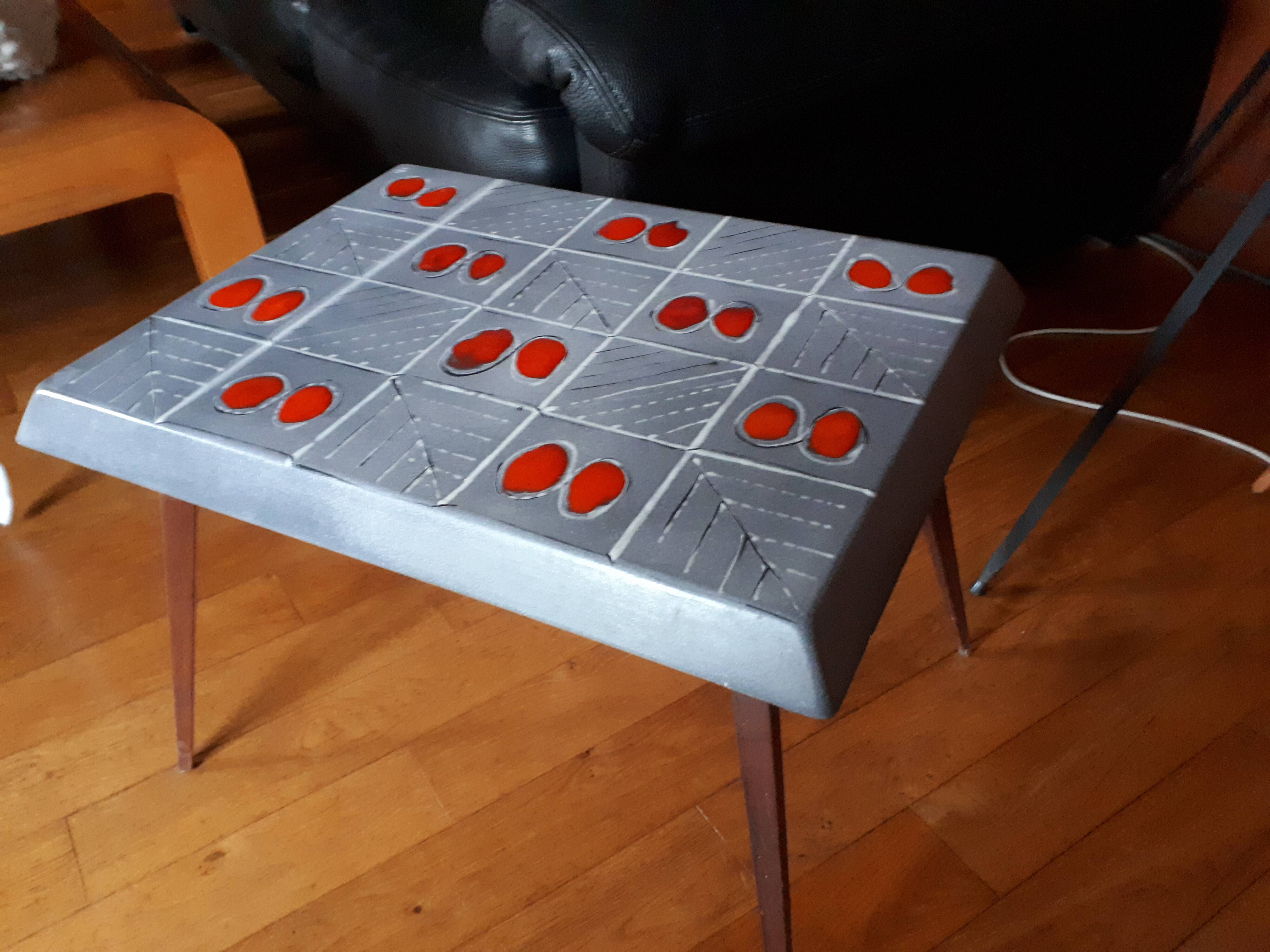 Small 1960s enamelled table, spindle legs, signed jd.