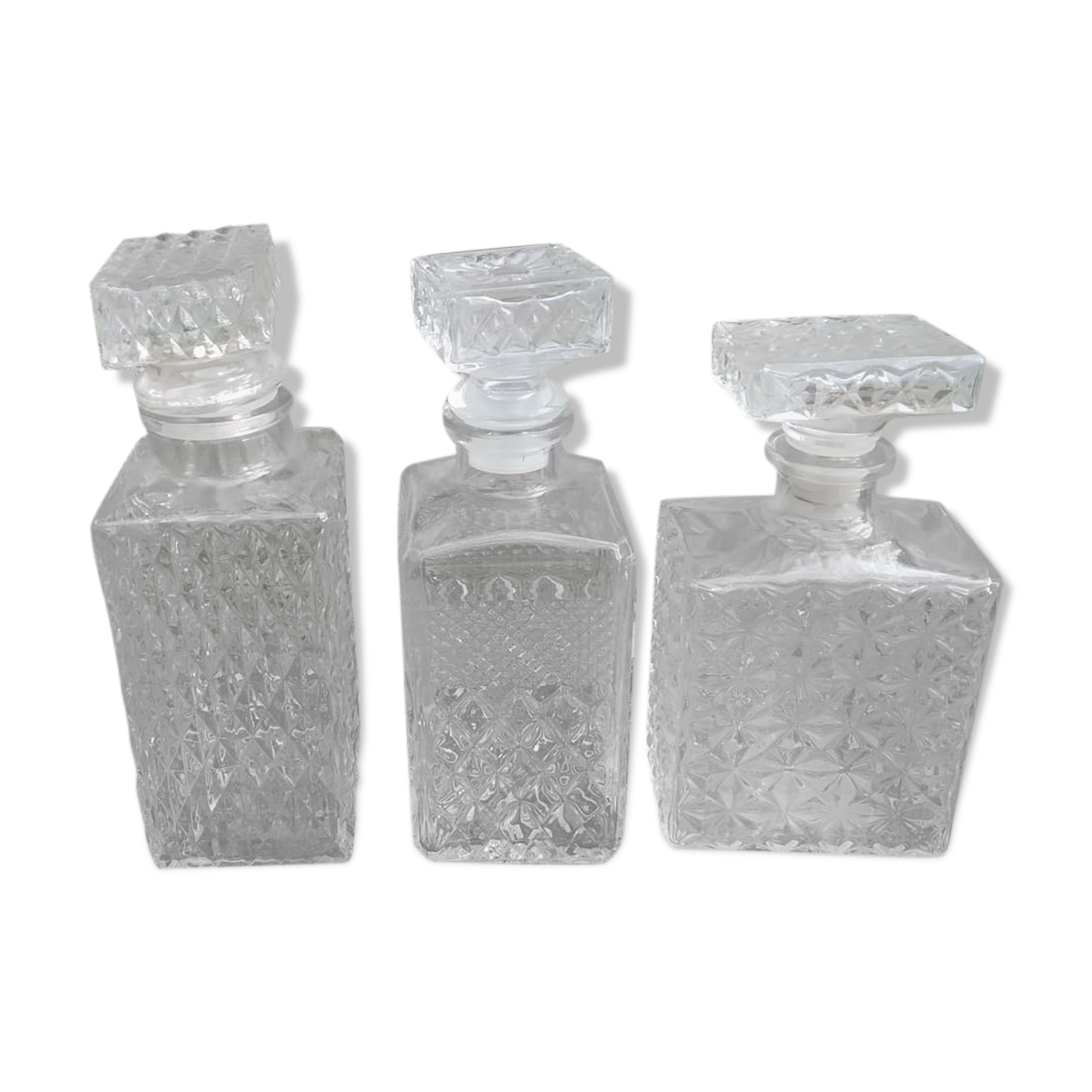 3 glass whiskey bottles
