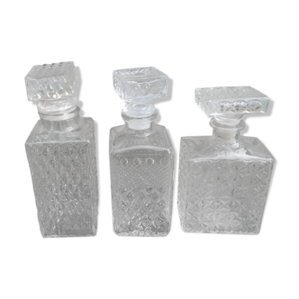 3 glass whiskey bottles