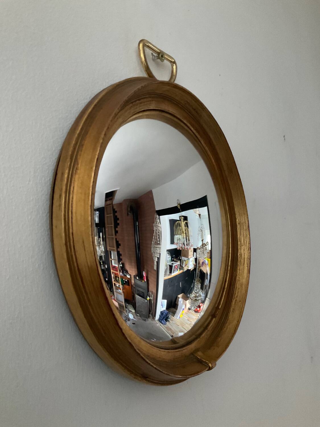 Vintage witch's eye mirror in gilded wood