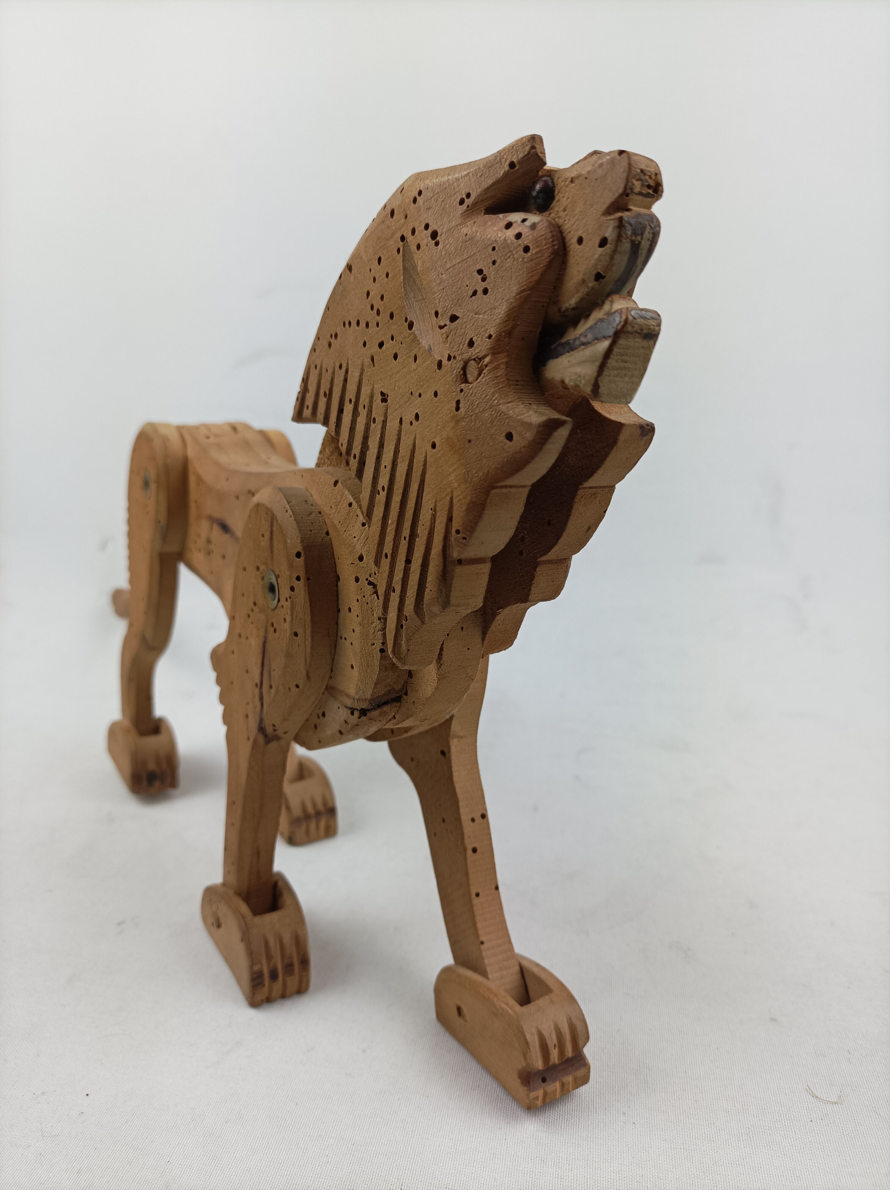 Articulated wooden lion