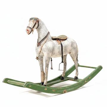 Antique wooden rocking horse, vintage toy with original patina.