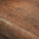 Comfortable sheepskin armchair with matching piping and a timeless look
