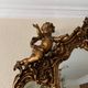 Golden Rococo-style mirror with chest