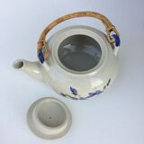 Vintage teapot with rattan handle