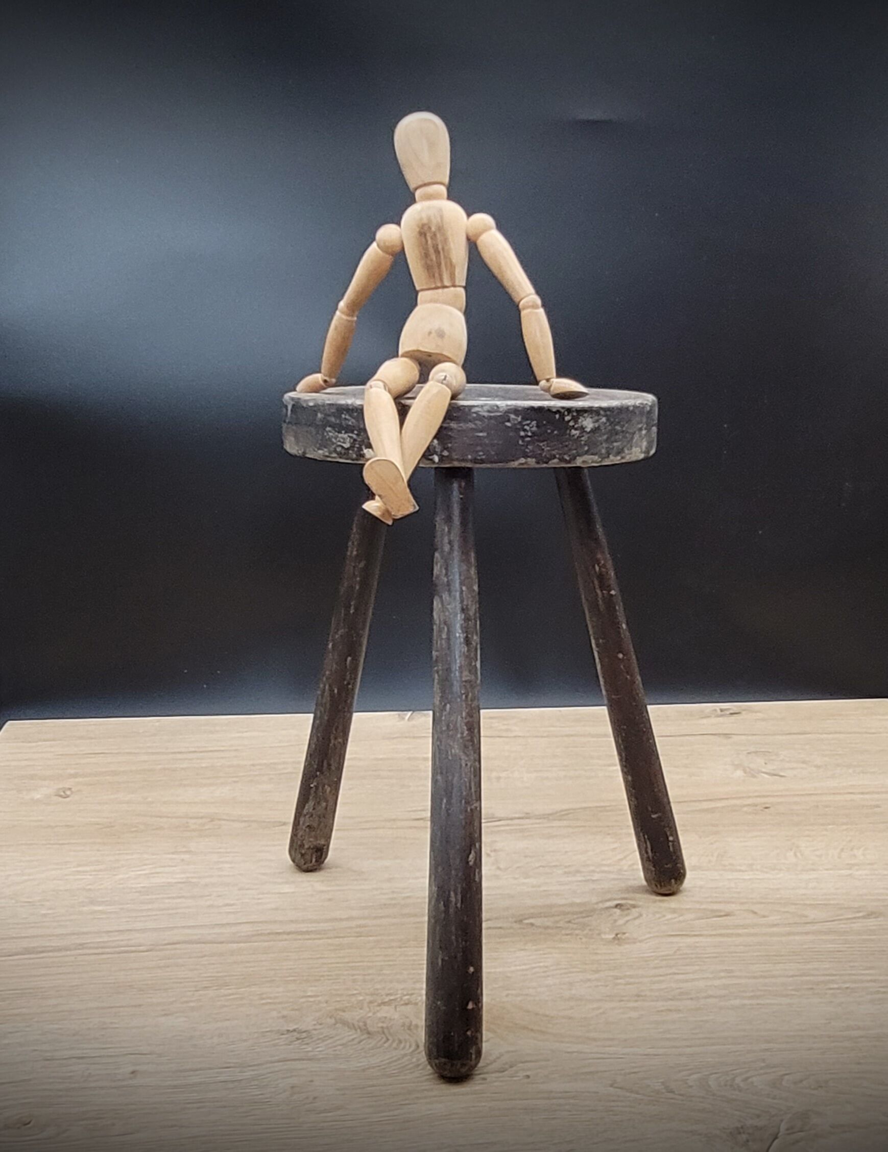 Massive black tripod stool