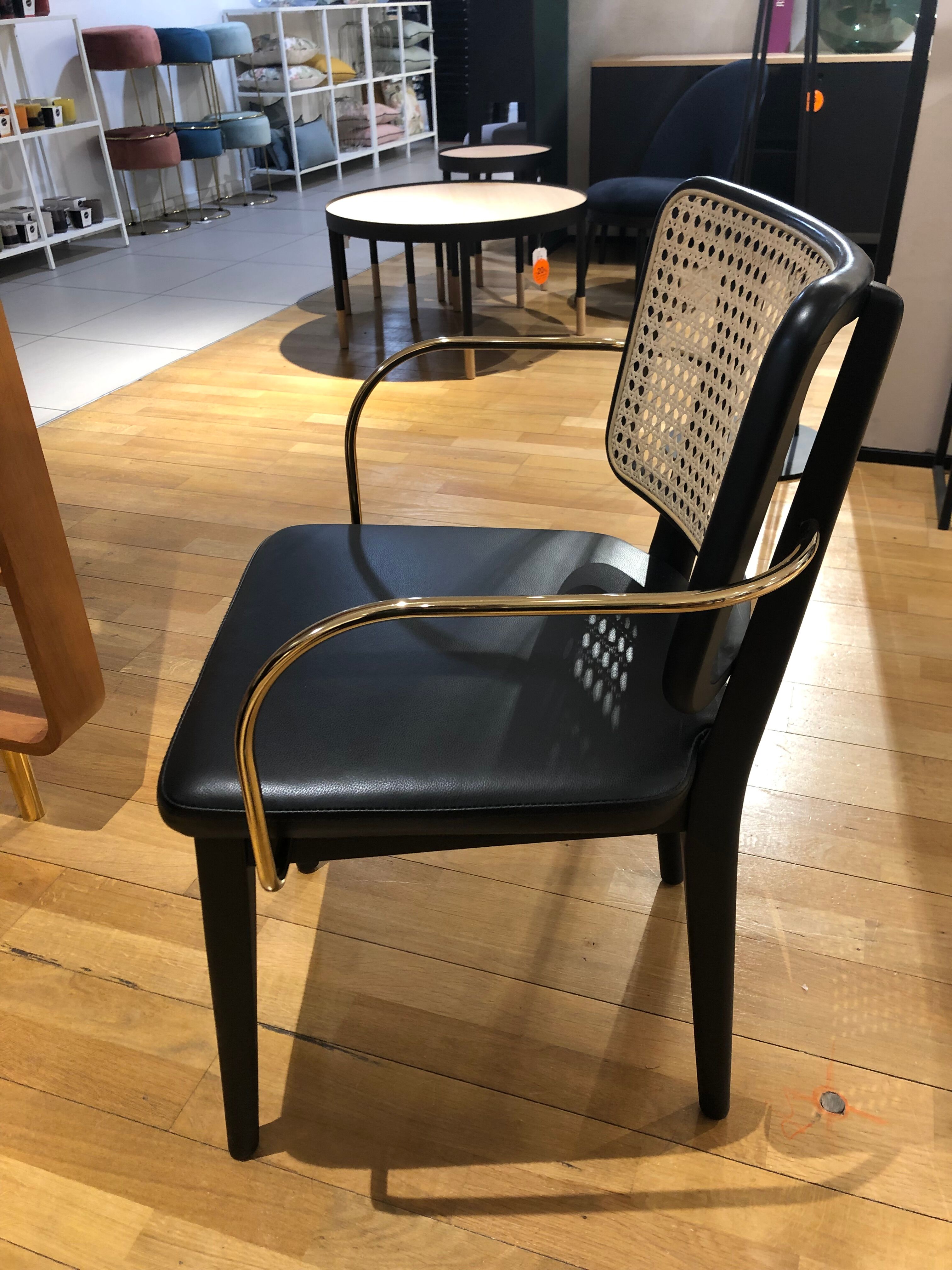 Black leather black wooden cannage chair with armrests