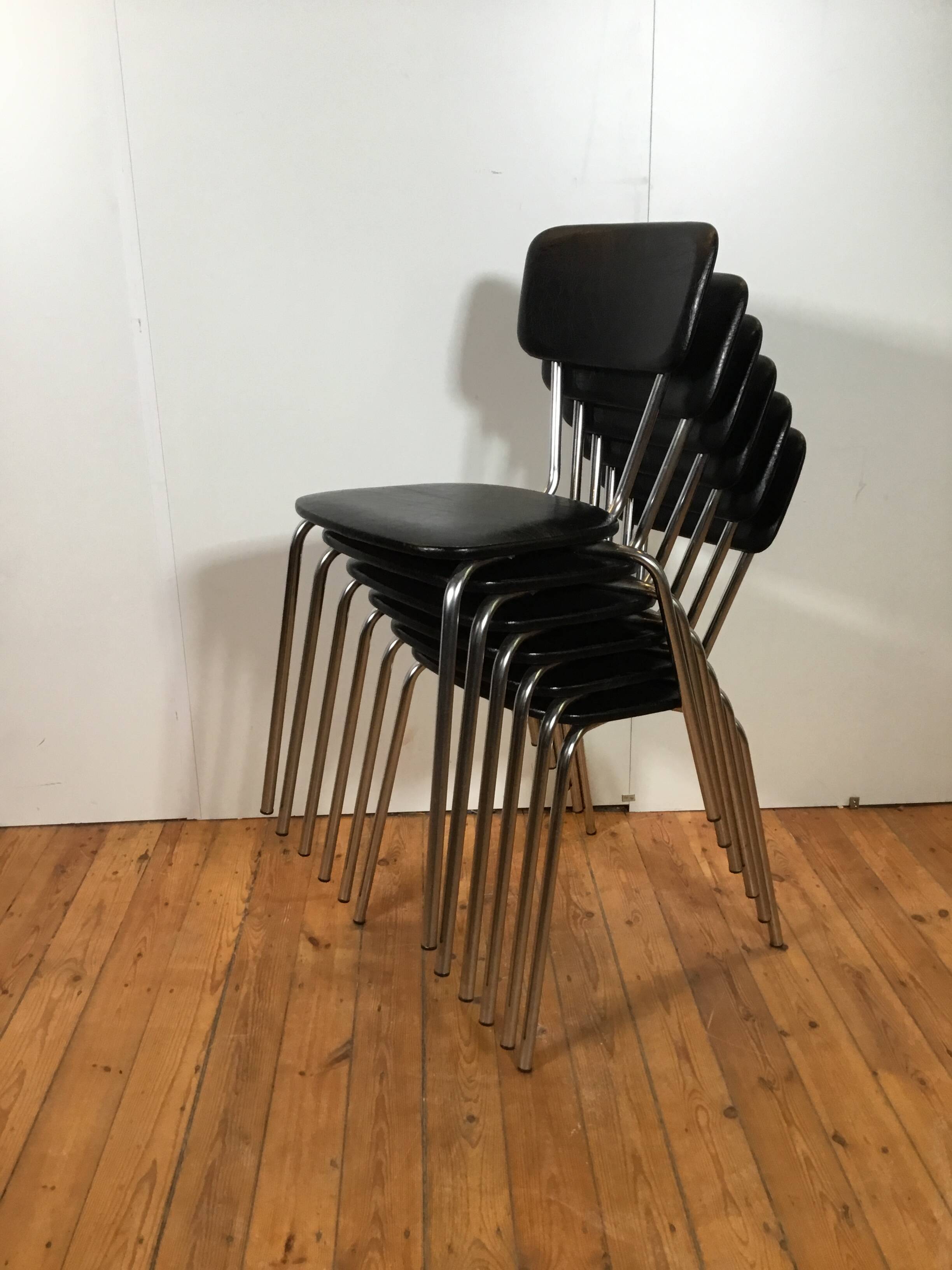 vintage chromed tubular steel stackable dining chairs