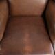 Cowhide wingback armchair in English style finished with decorative nails