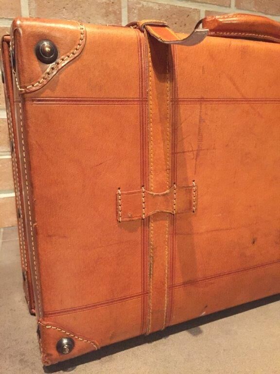 Thick leather suitcase