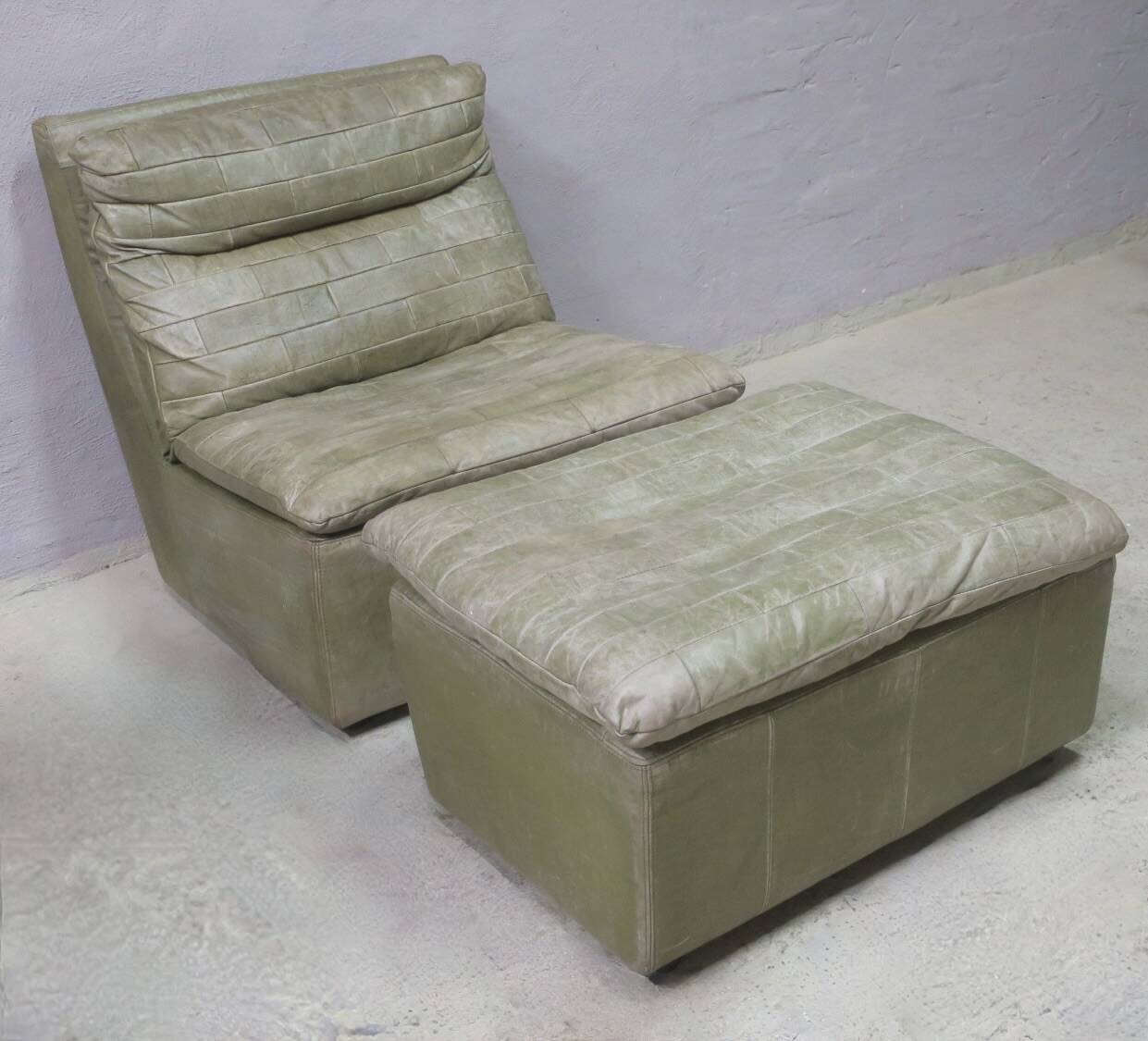 Laauser armless patchwork olive leather lounge chair and ottoman, 1970s