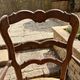 Antique Provençal armchair in wood with a straw seat.