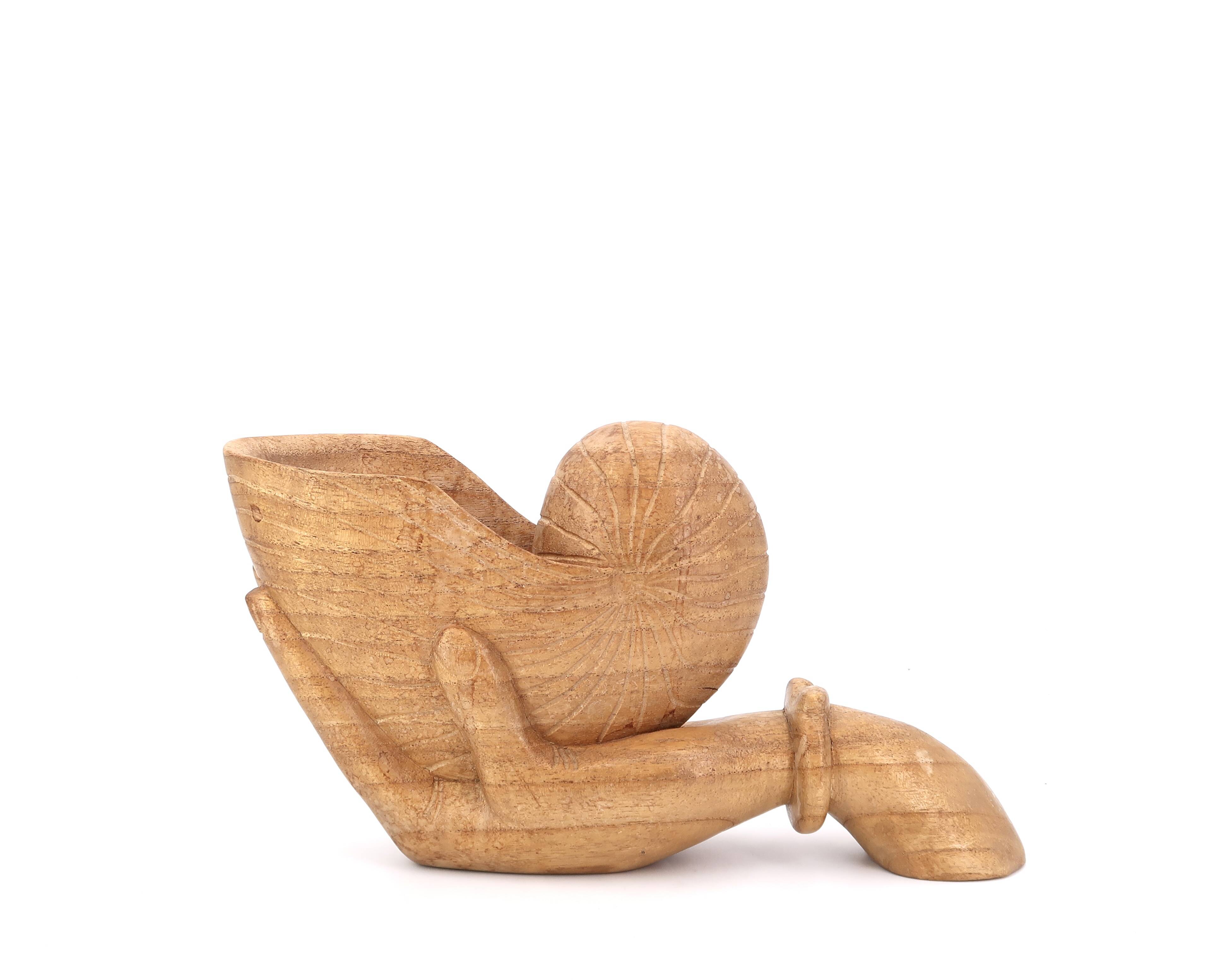 Wooden hand emptier holding a shell, 1970s