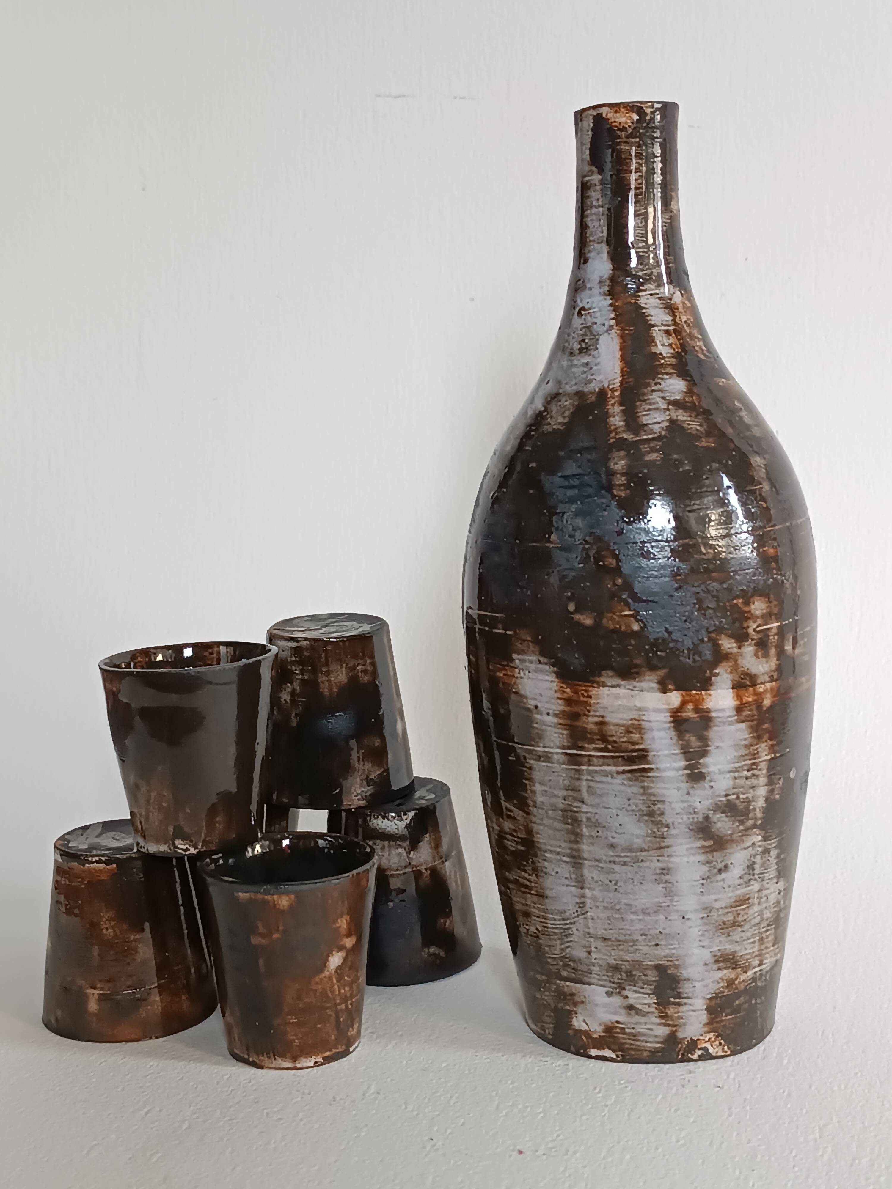 A bottle and six ceramic cups by Gérard Hofmann Vallauris 1950.