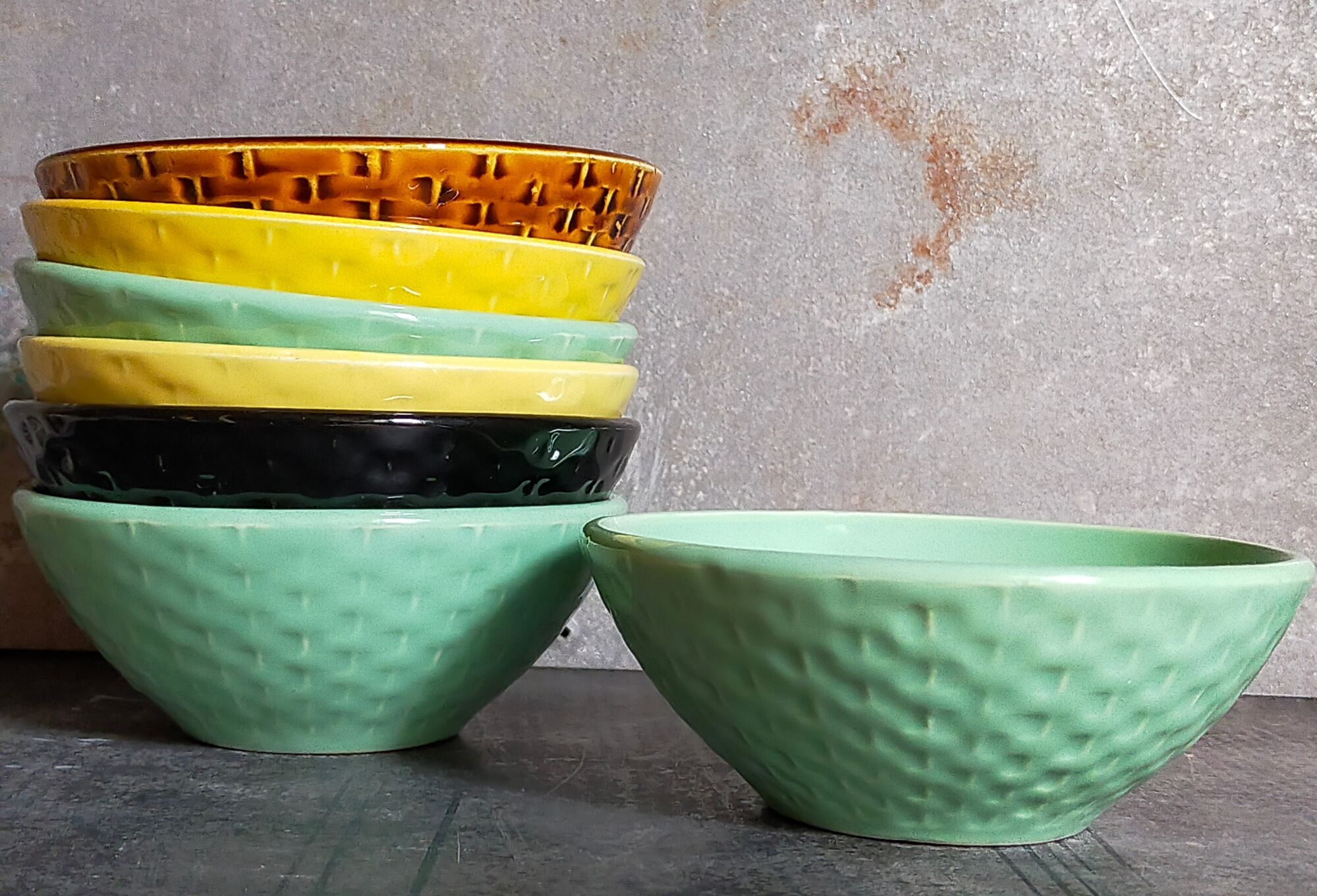 Seven vintage slip ceramic bowls