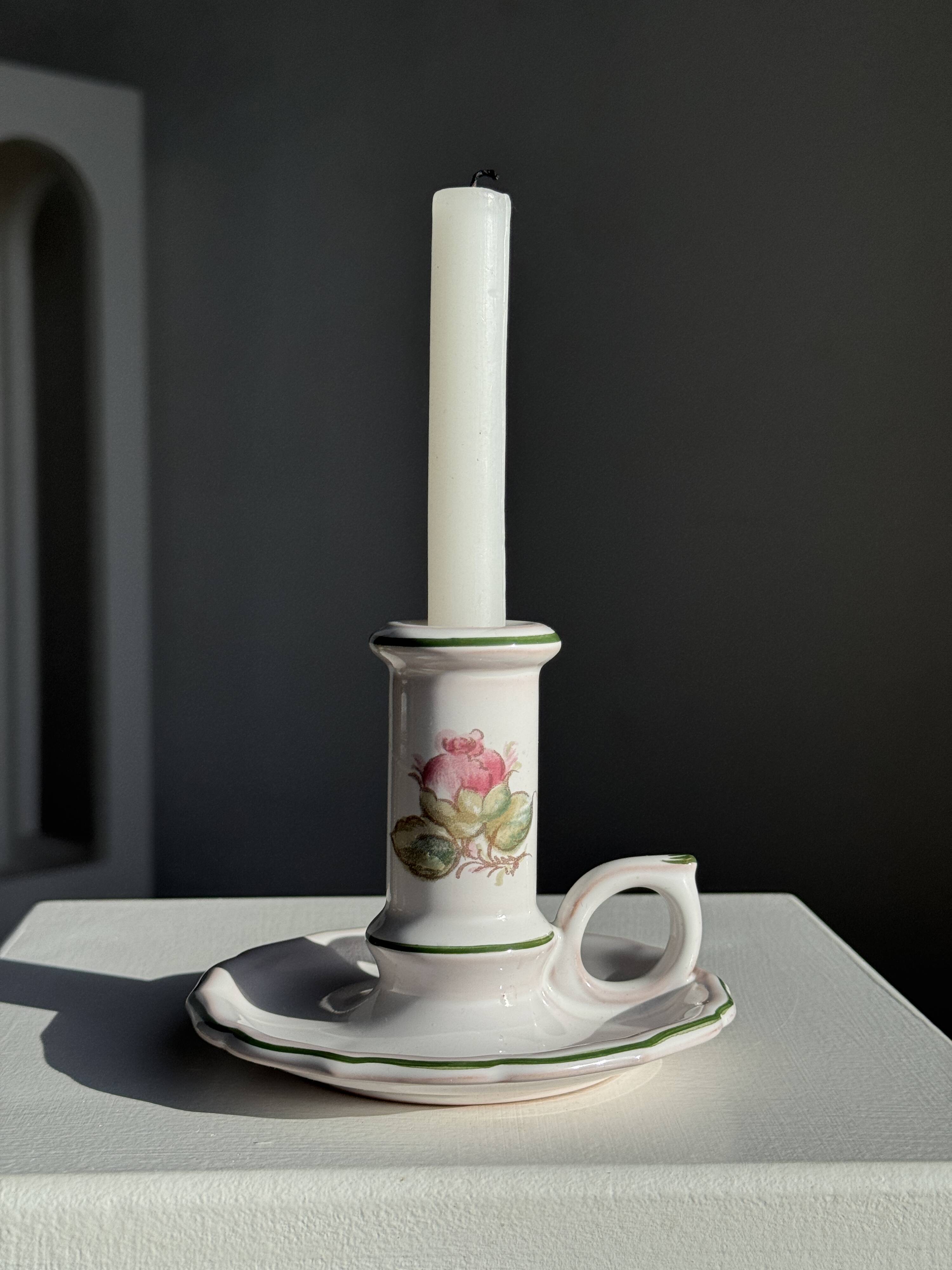 Small vintage hand-held candlestick in earthenware with green trim and floral decoration H10.5