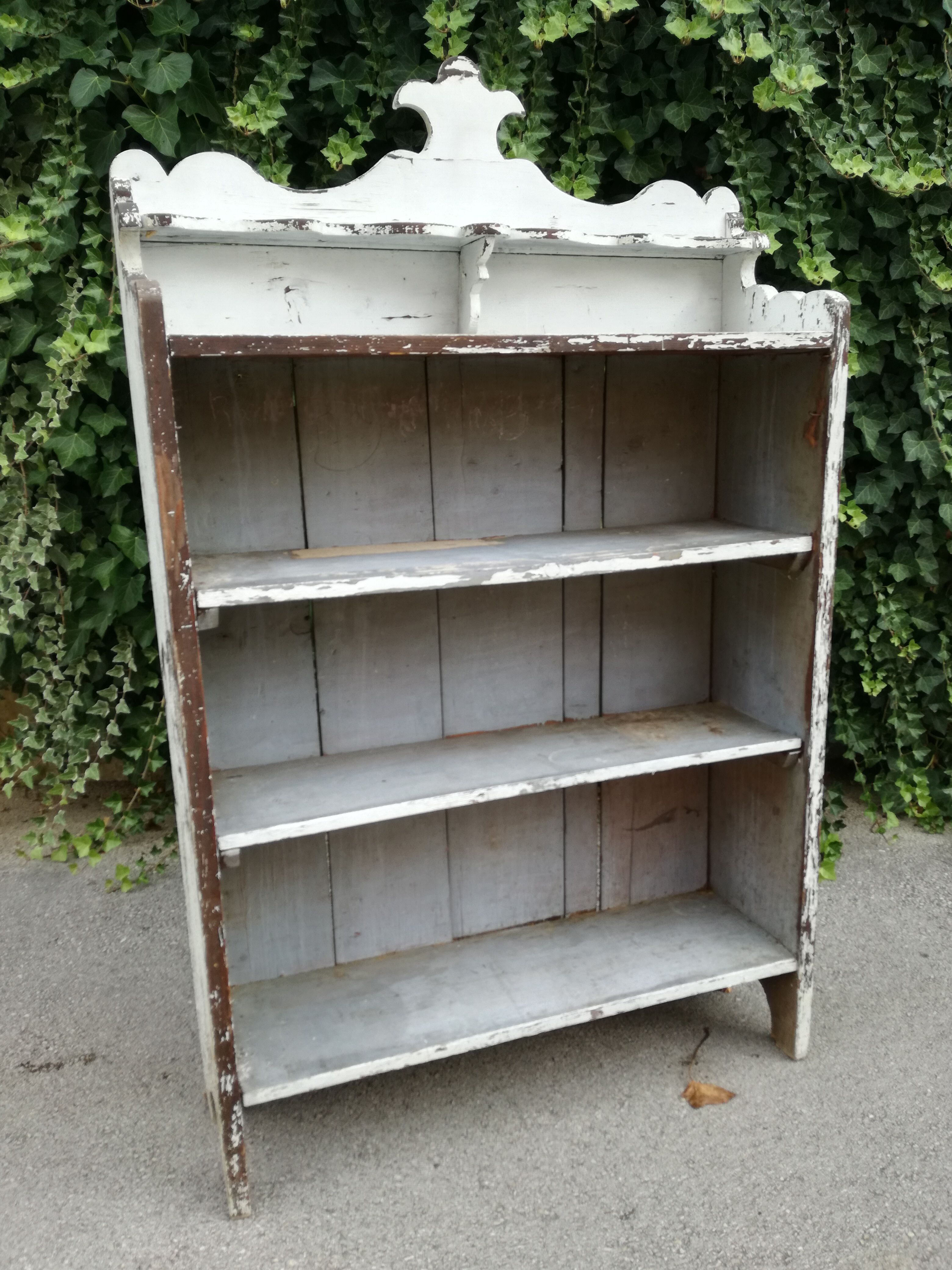 Old white shelf in weathered pine
