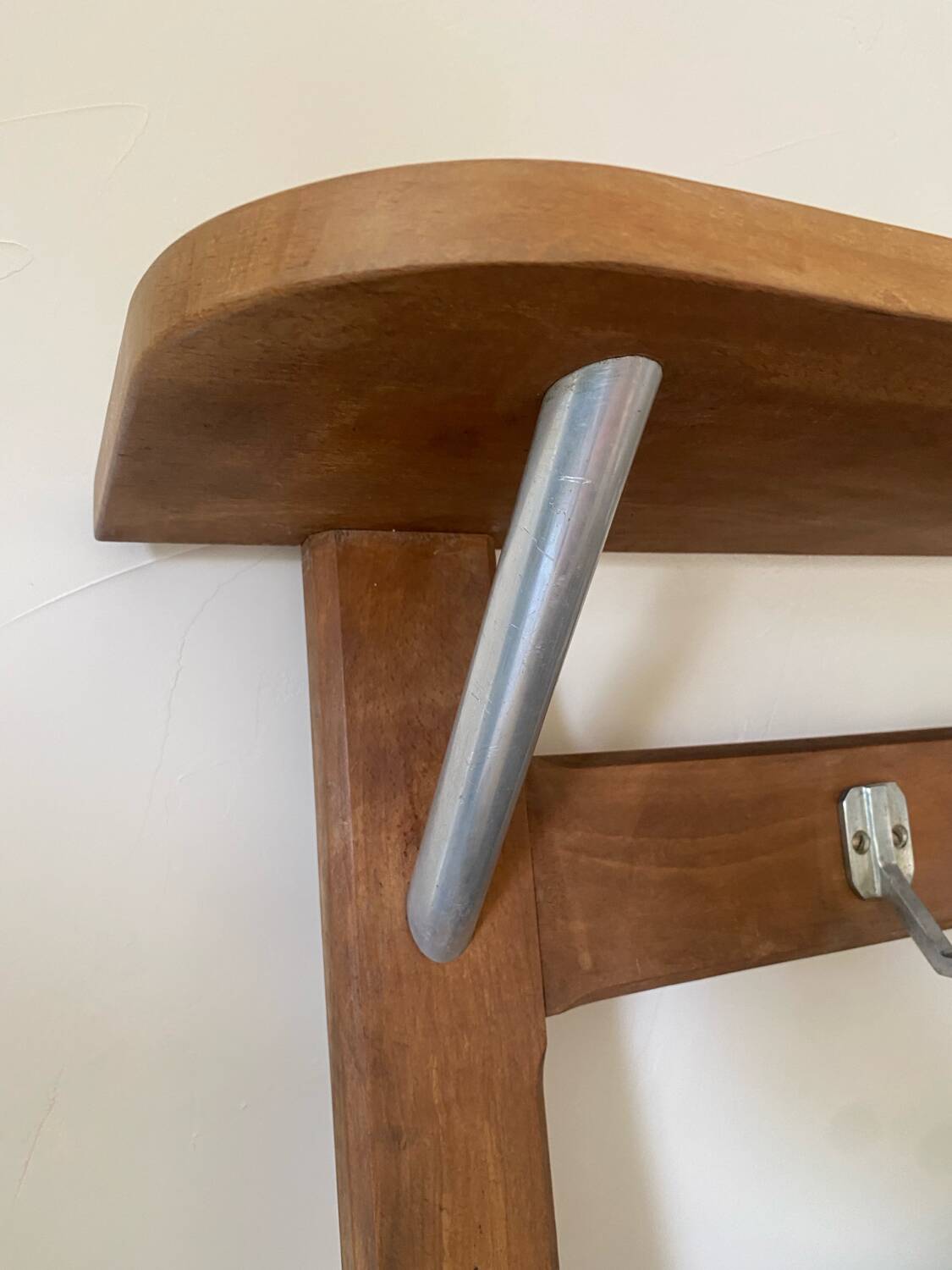 Wall-mounted coat rack with vintage hooks