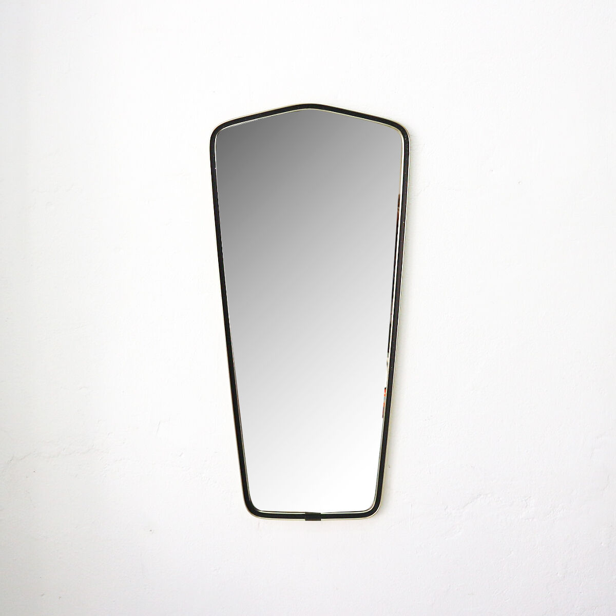 '50s wall mirror with relief brass frame