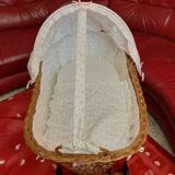 Vintage 1970s wicker cradle on wheels