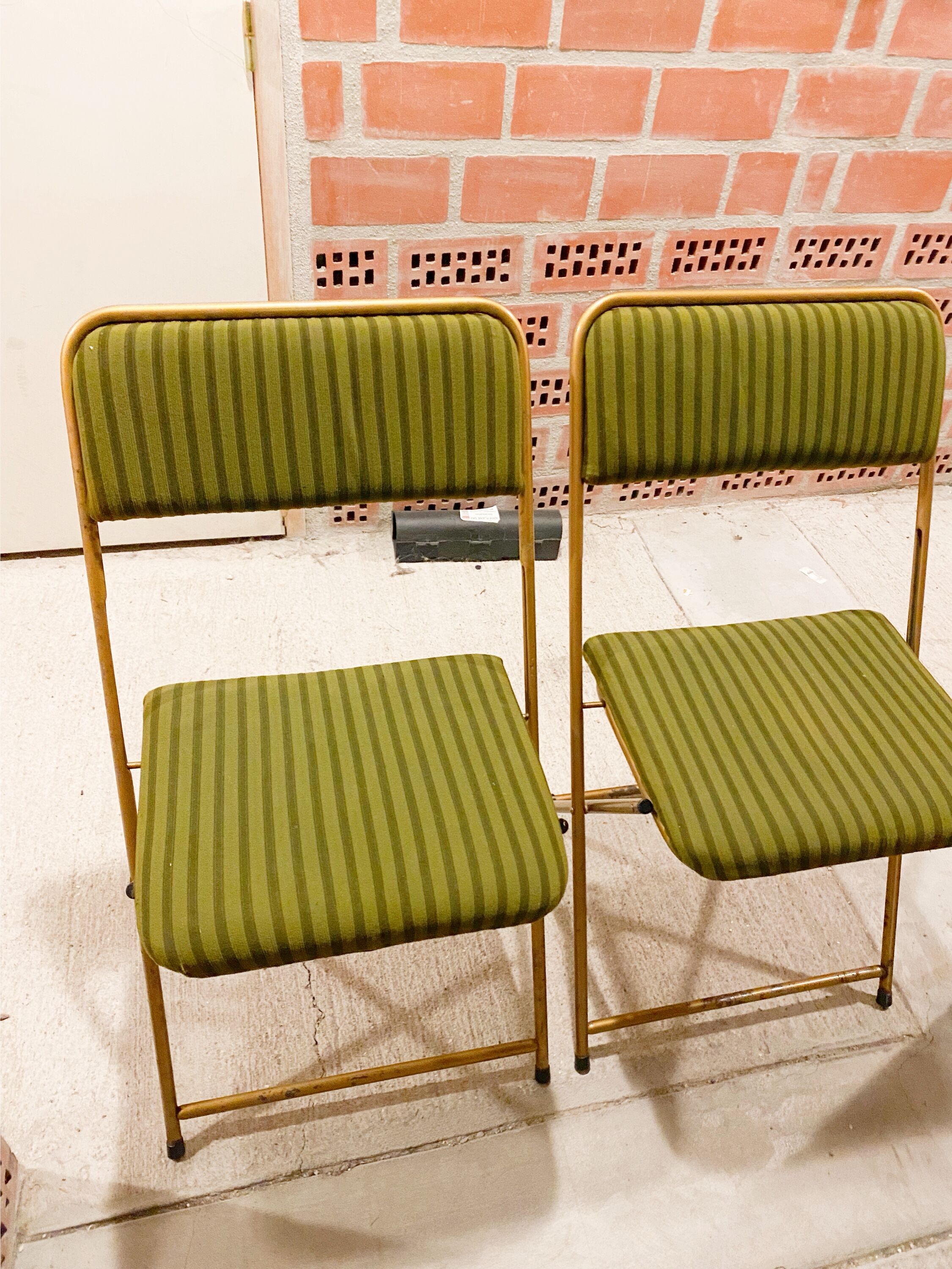 Two green and golden chairs