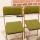 Two green and golden chairs