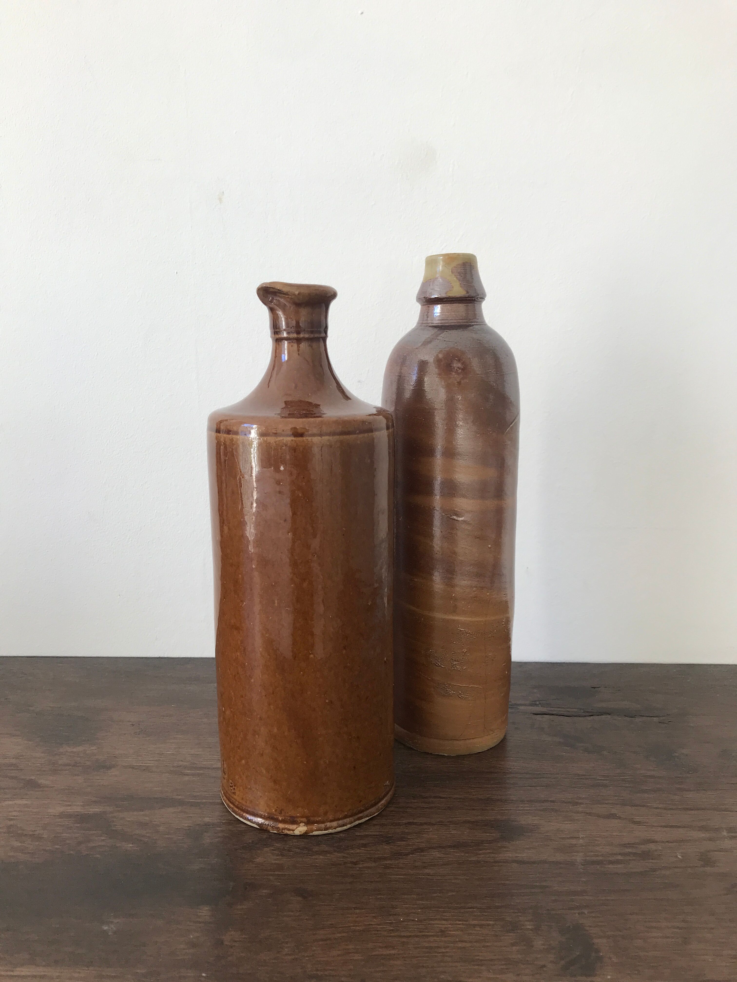 Pair of sandstone bottles