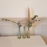 Suite of three old small glass bottles