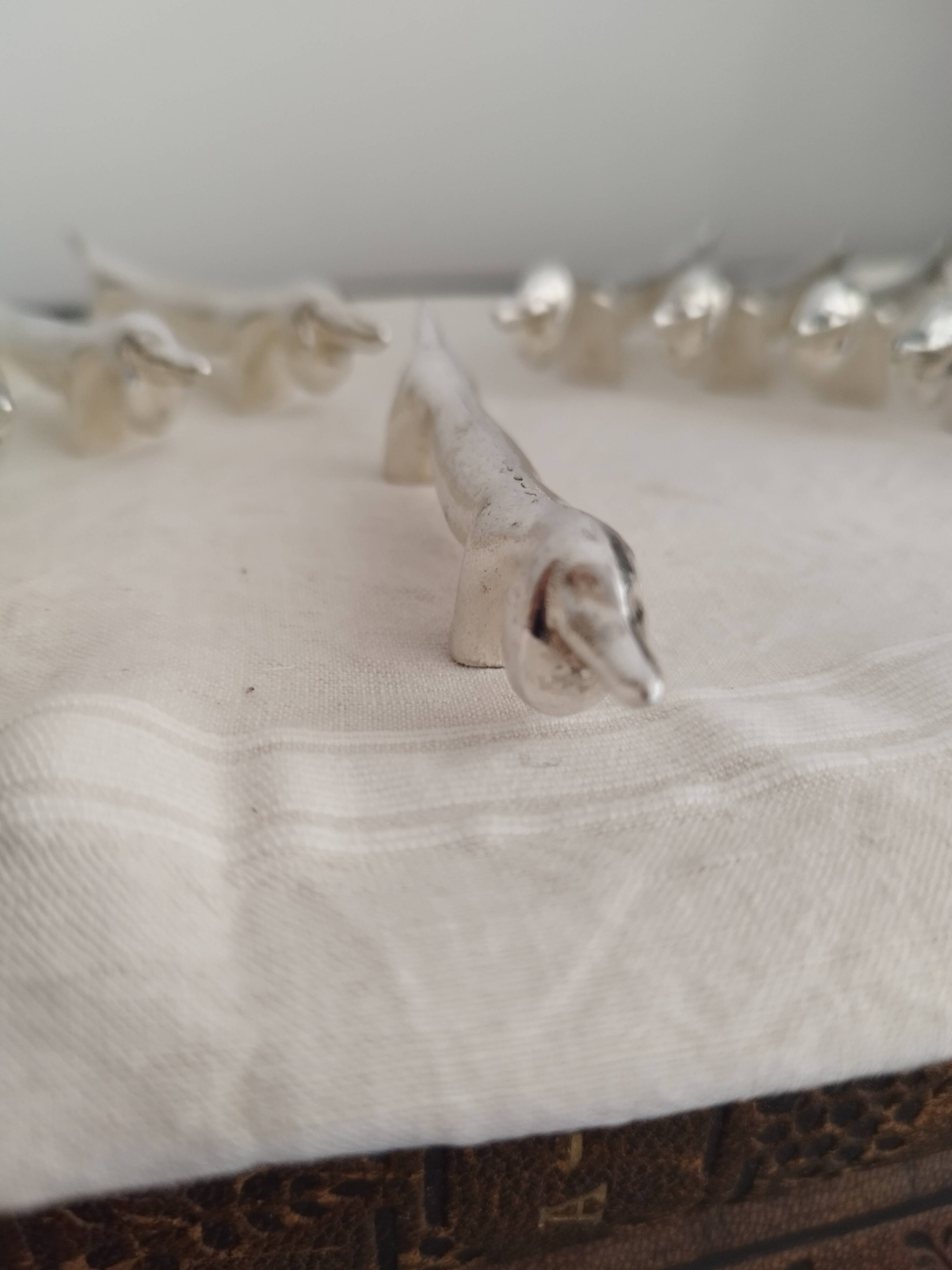 Silver metal knife holders with Dachshund dogs